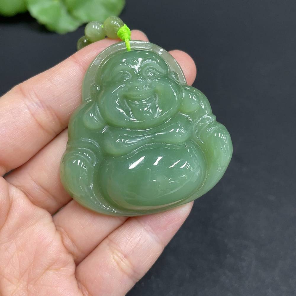 Huiliu certified Hetian jade pendant featuring a Buddha design with a matching chain, showcasing smooth, polished green jade craftsmanship.