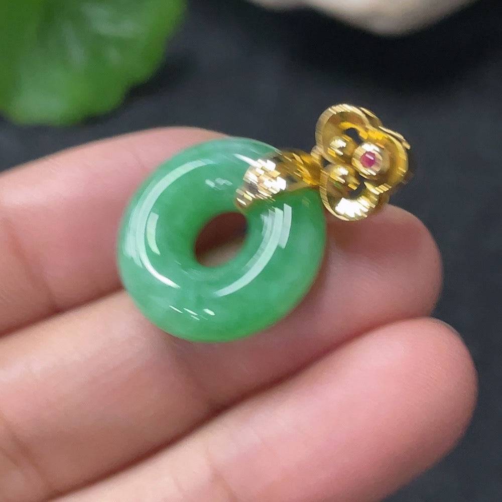 HUILIU HQ jadeite pendant donut with suspected plating, showcasing a smooth, polished jade gemstone with a carved hole in the center.