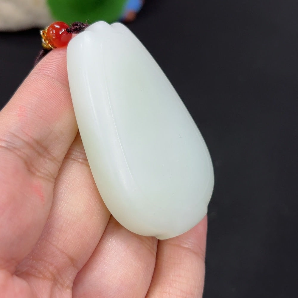 Plain Hetian jade pendant with cord, weighing approximately 48.1g, featuring smooth, polished jade stone by HKHQ.