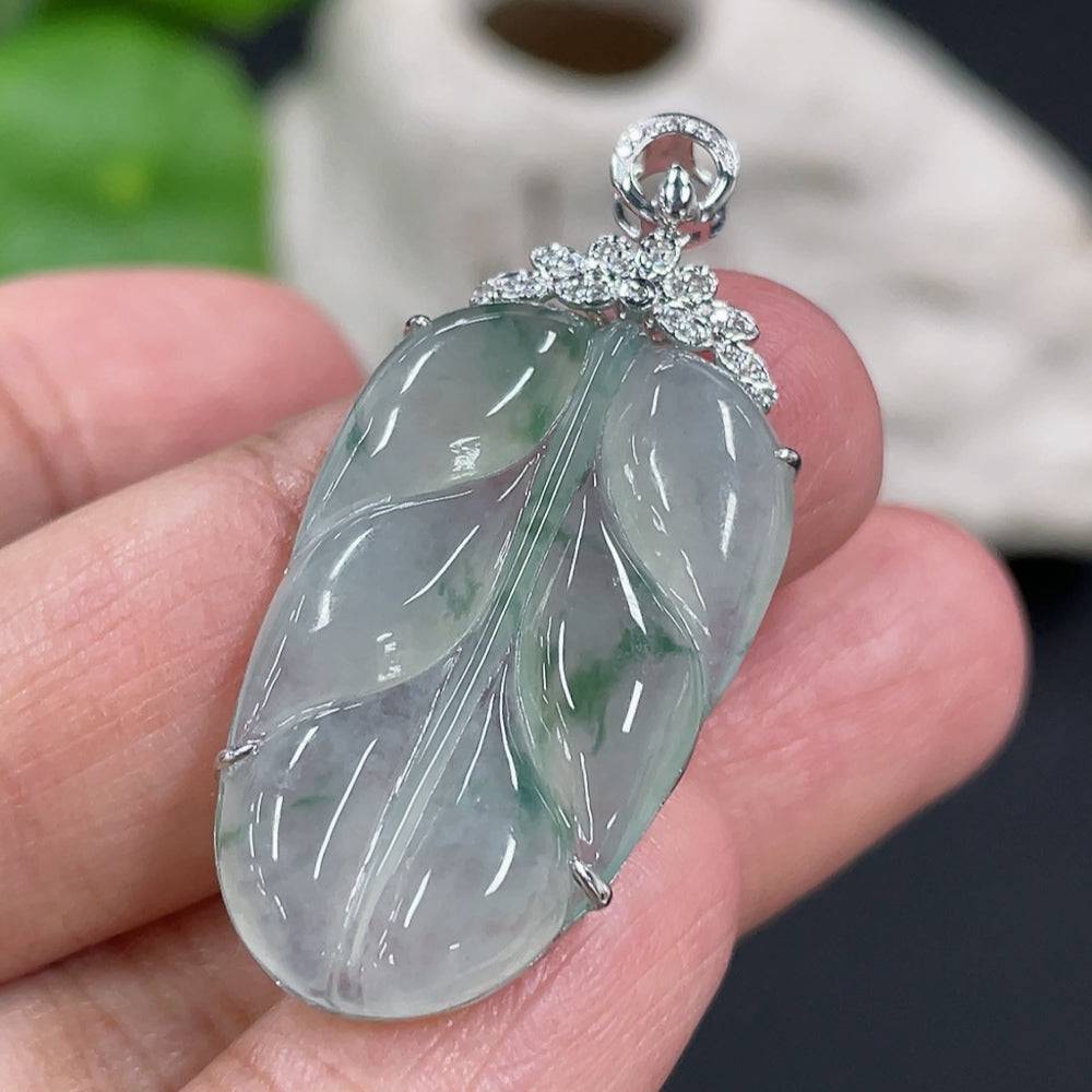 Jadeite leaf pendant with diamond accents in 18K gold setting, crafted by HUILIU HQ, weighing approximately 4.6g.