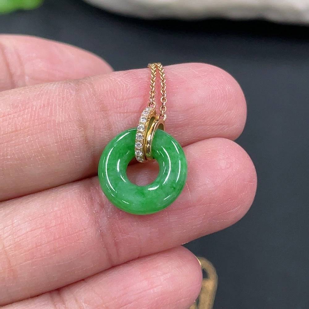 Elegant jadeite donut pendant with 18k chain from HUILIU HQ, showcasing smooth, polished green jade with a luxurious finish.