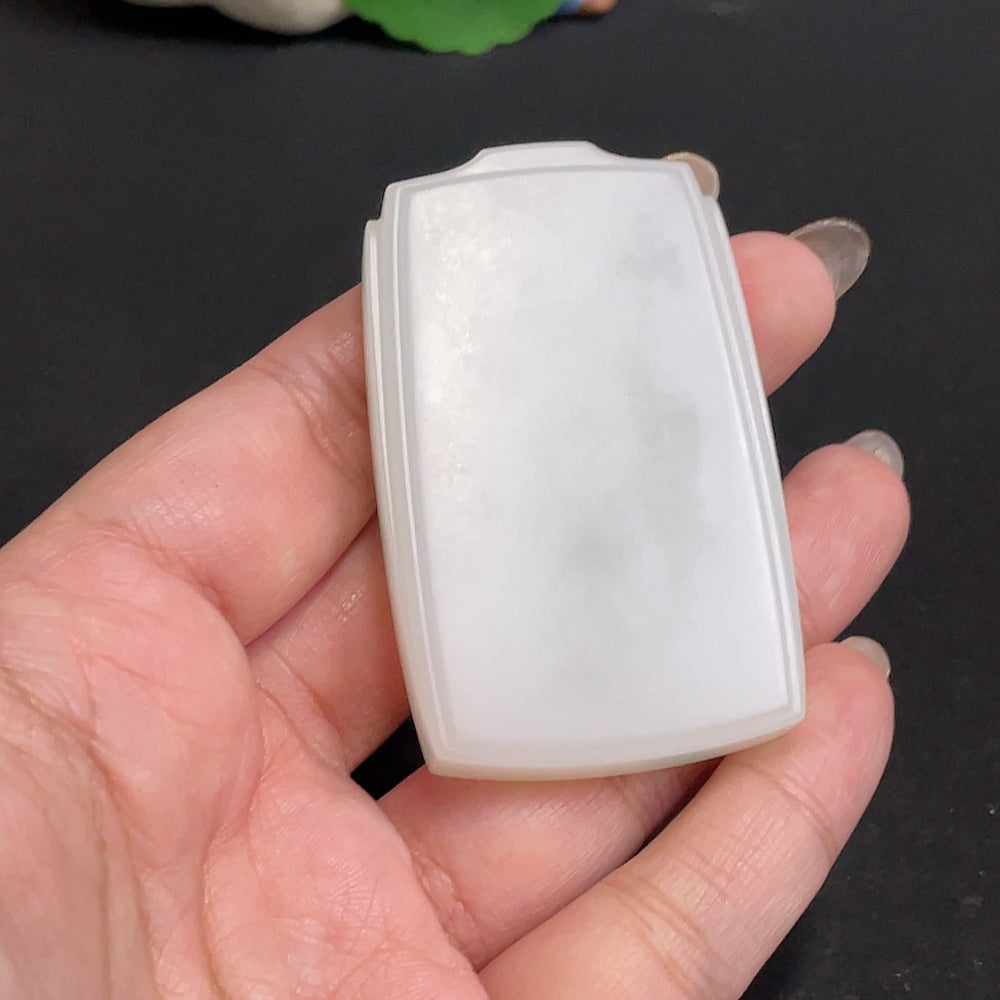 Huiliu certified Hetian jade pendant with a plain, smooth surface, showcasing the elegant natural green jade stone.