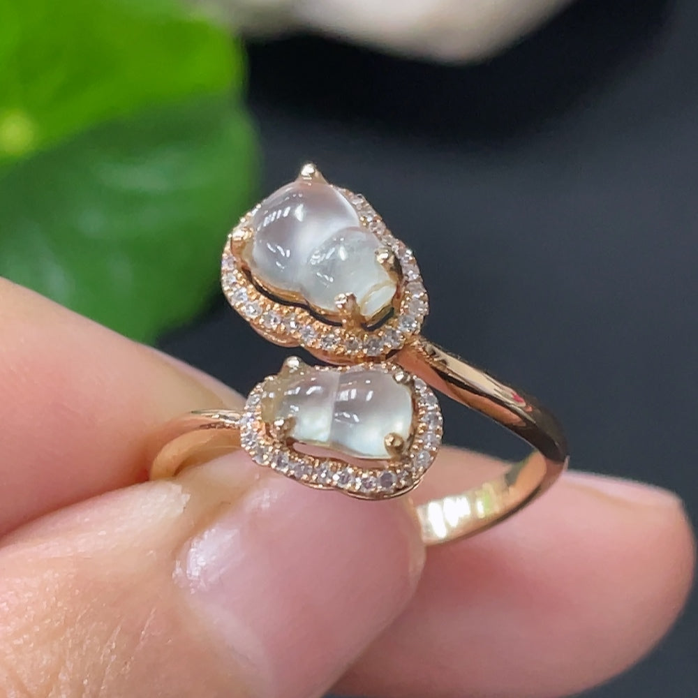 Huiliu Jadeite ring with diamond accent, sterling silver band, and Huiliu certification, showcasing a polished jade gemstone.