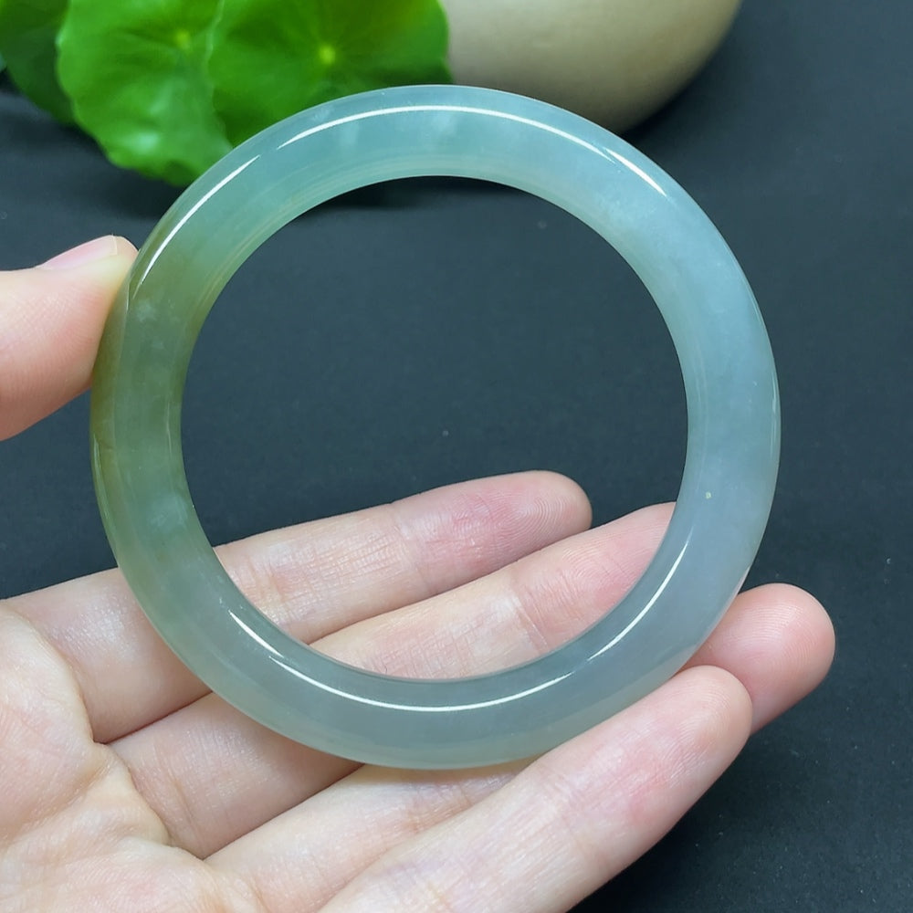 HKHQ jadeite round bangle in size 52.4 with a weight of 41.46g, showcasing smooth, polished green jadeite bracelet.