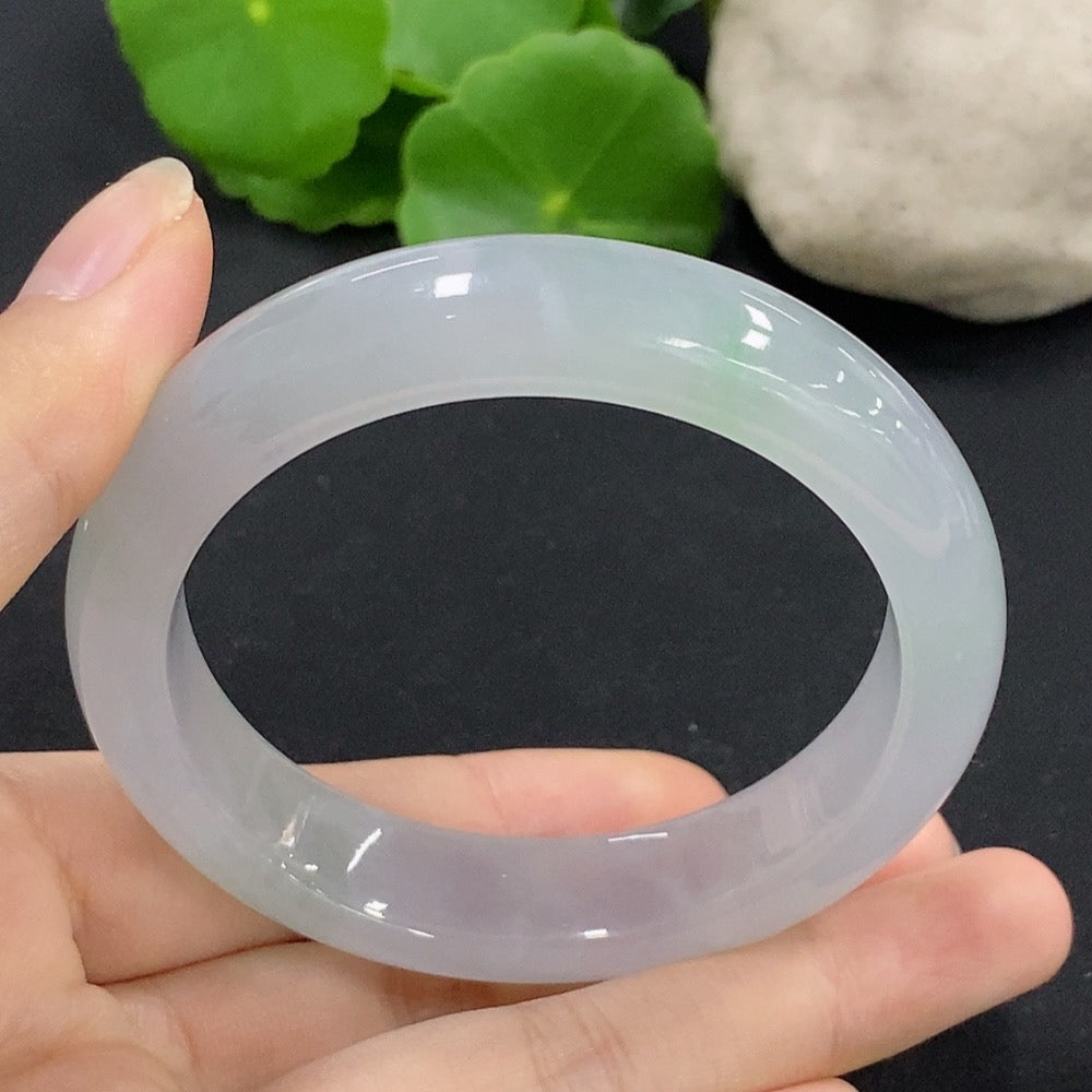 HKHQ Jadeite round bangle in size 54.5, showcasing smooth, polished jadeite with a rounded shape and elegant finish.