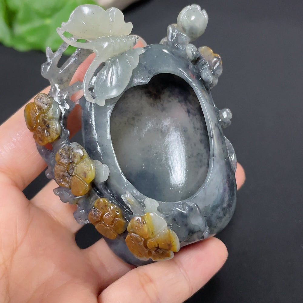 Huiliu Hetian Jade ornament featuring butterflies and flowers, with natural mineral variations and undetermined skin color.