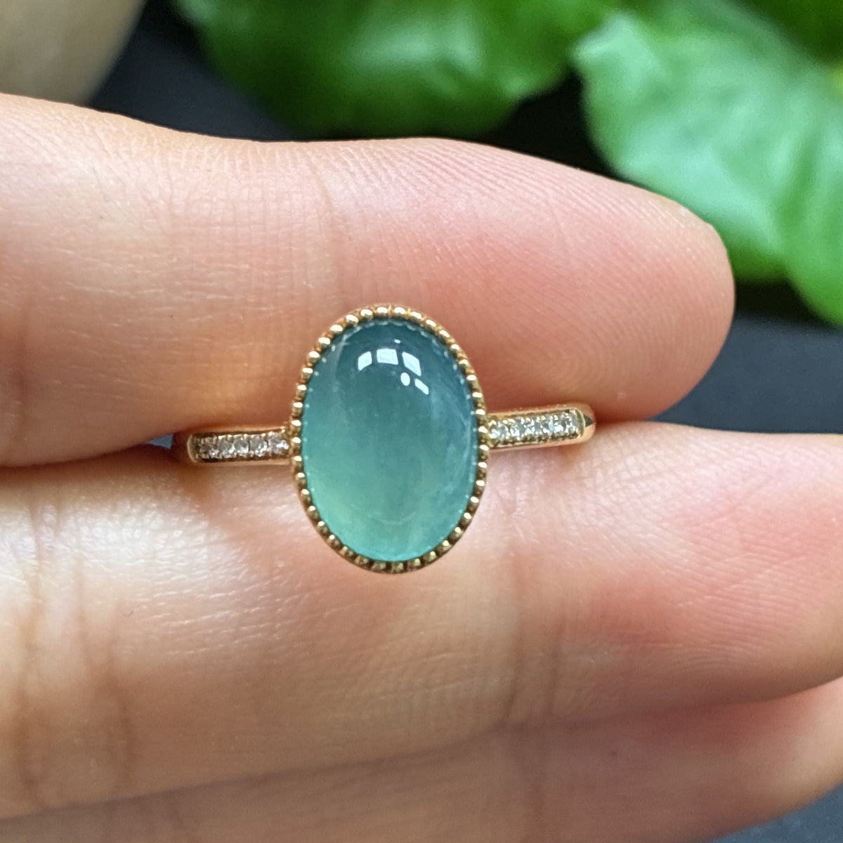 Gold ring featuring a jadeite cabochon and small diamonds, crafted in 18k gold with a total weight of 2.51 grams.