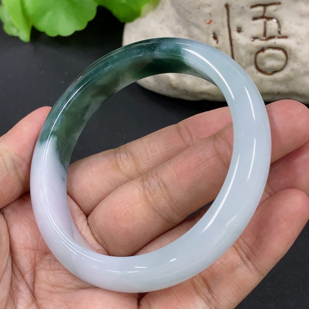 HKHQ jadeite round bangle bracelet, 55.5mm size, approximately 51.68g, showcasing smooth, polished jadeite with a glossy finish.