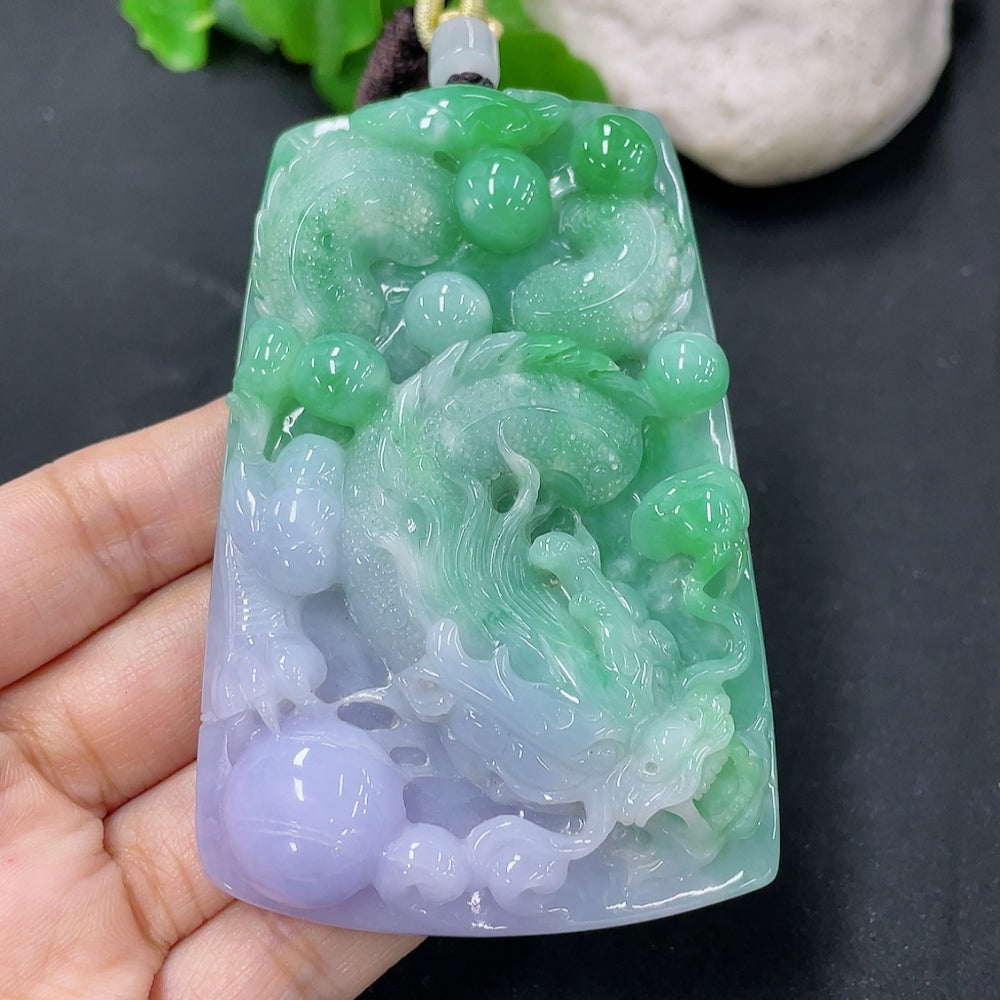 Jadeite dragon pendant from HKHQ featuring a detailed jade pendant with carved dragon design, weighing approximately 103.89g.