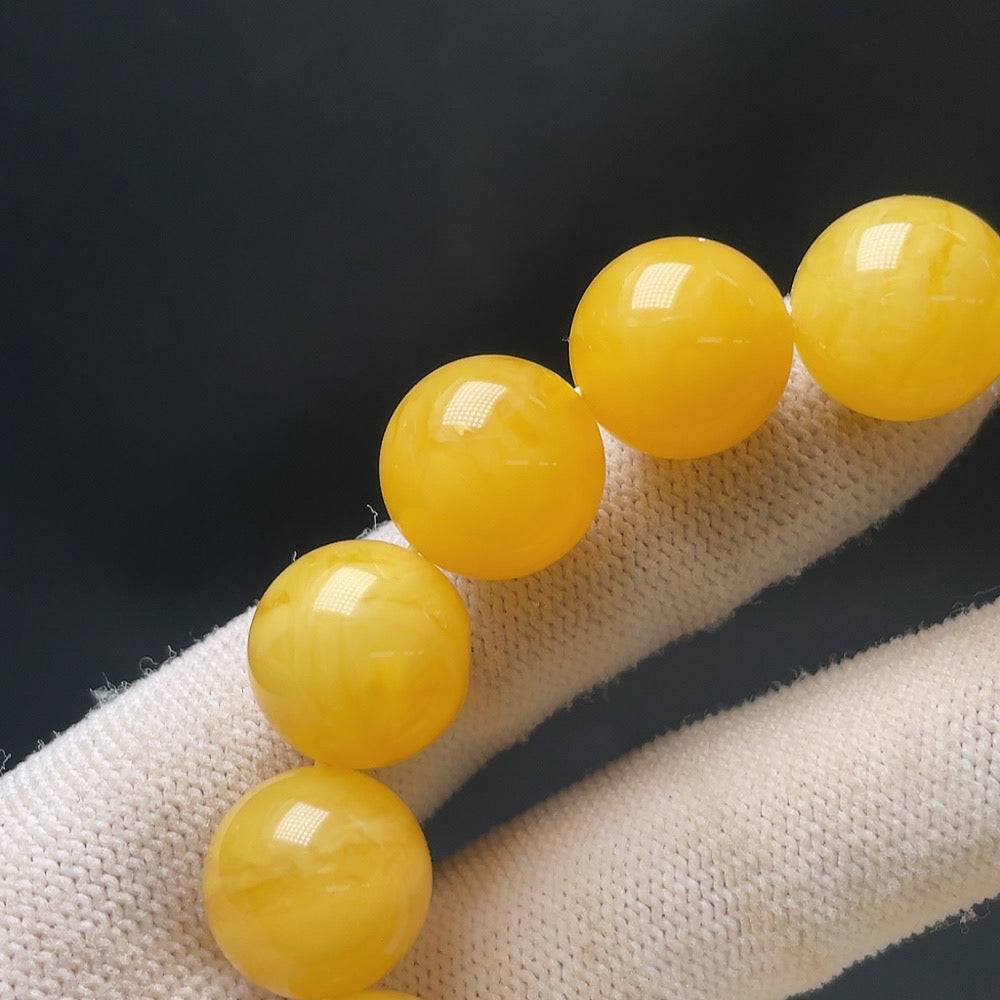 Amber beeswax bracelet from HUILIU HQ featuring natural amber beads, approximately 14.1mm in size and 23.8g in weight.