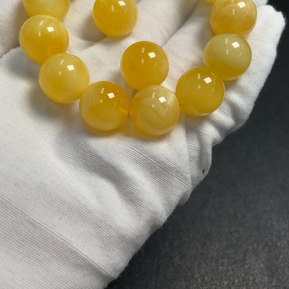 Huiliu Amber Beeswax bracelet with loose beads, approximately 14.6mm, featuring natural amber stones and certified quality.