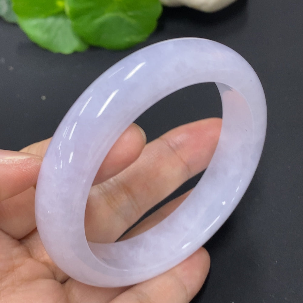 HKHQ jadeite round bangle, size 56.6, weighing approximately 67.5g, showcasing smooth, polished jadeite surface.