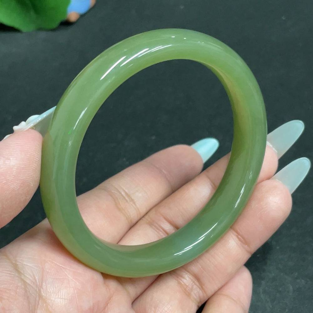 Huiliu Certified Hetian Jade round bracelet showcasing smooth, polished jade beads on a delicate string.
