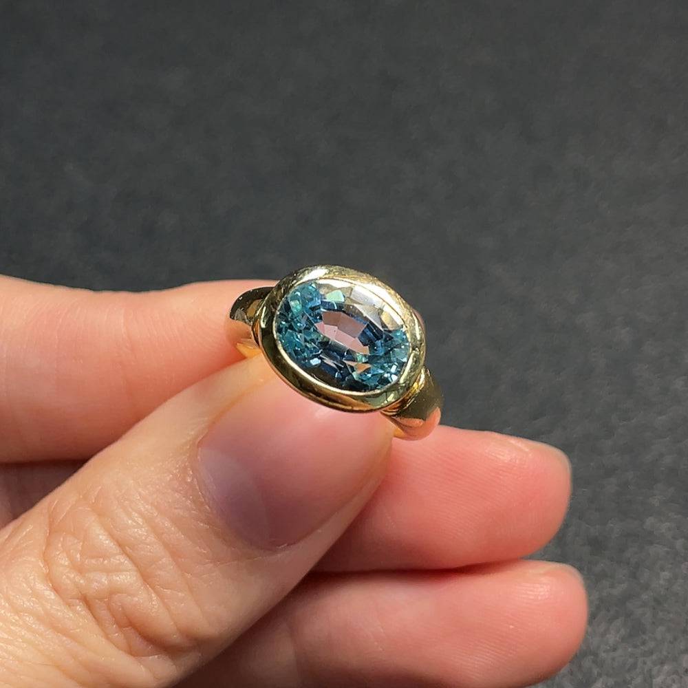 Gold Topaz ring with gemstone setting, size 9, 74% gold content, weighing 6.21g, by HUILIU HQ, featuring a polished band