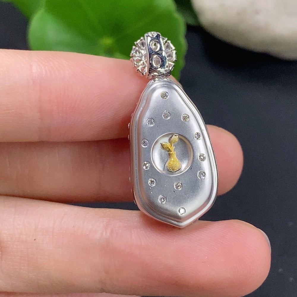 Jadeite lucky bean pendant necklace with 18K gold and diamond accents, featuring a polished jadeite gemstone and elegant design.