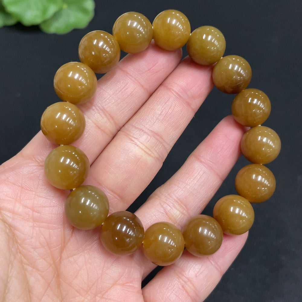 Hetian jade bracelet by HUILIU HQ featuring 11.6mm beads with a total weight of 42g, showcasing smooth, polished jade stones.