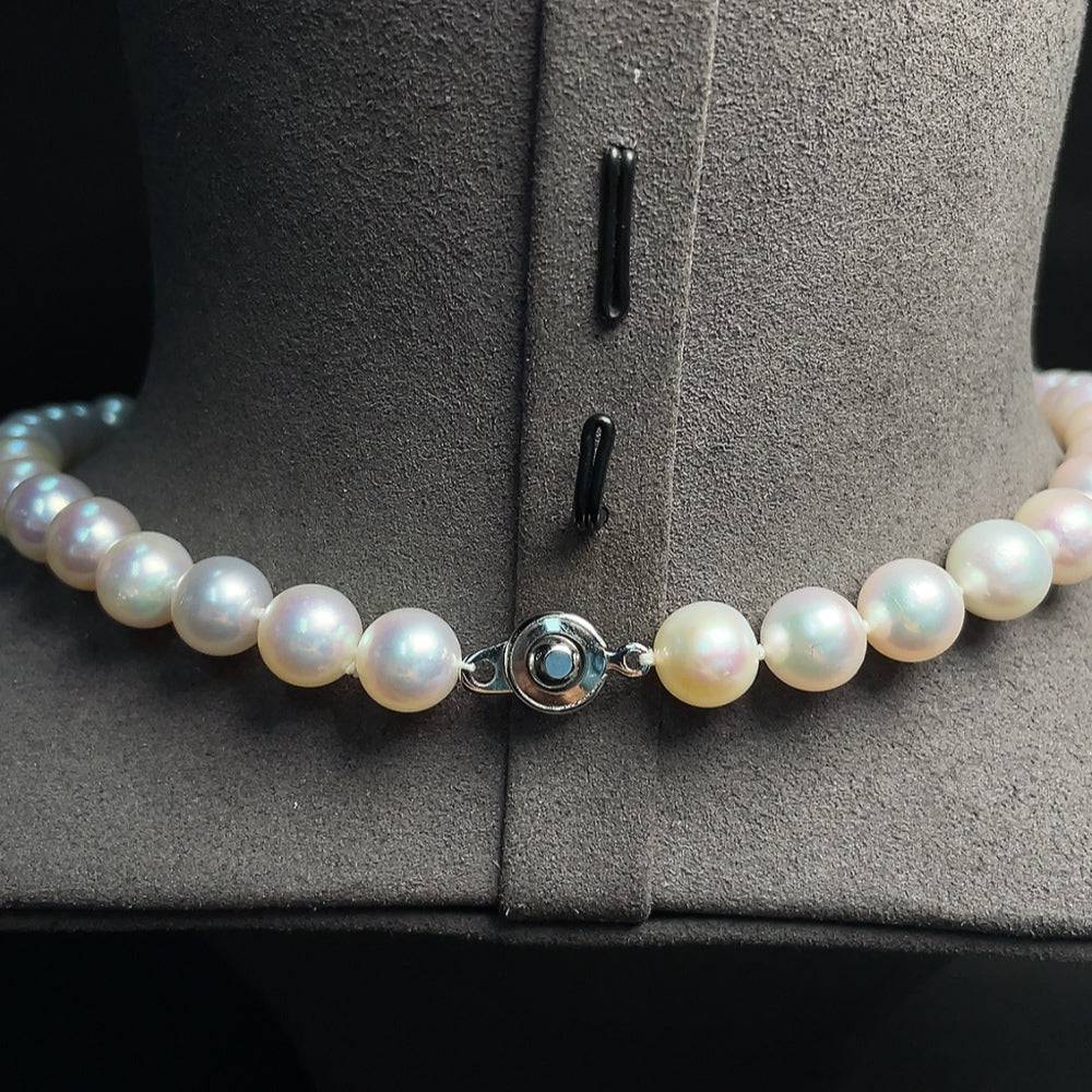 HUILIU HQ seawater pearl necklace with 49.76g weight and 9.7mm pearls, showcasing elegant lustrous pearls on a string.