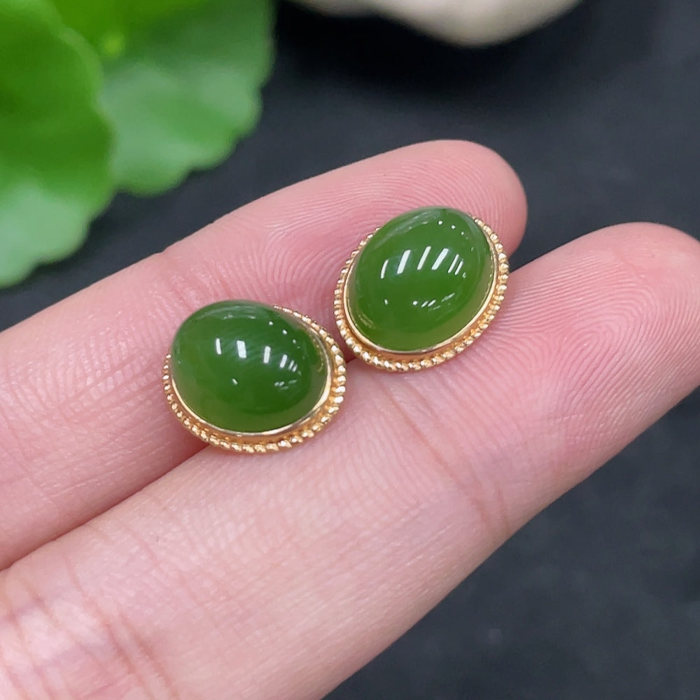 Huiliu certified Hetian jade cabochon earrings with gold setting featuring smooth, polished jade stones on elegant earring hooks.