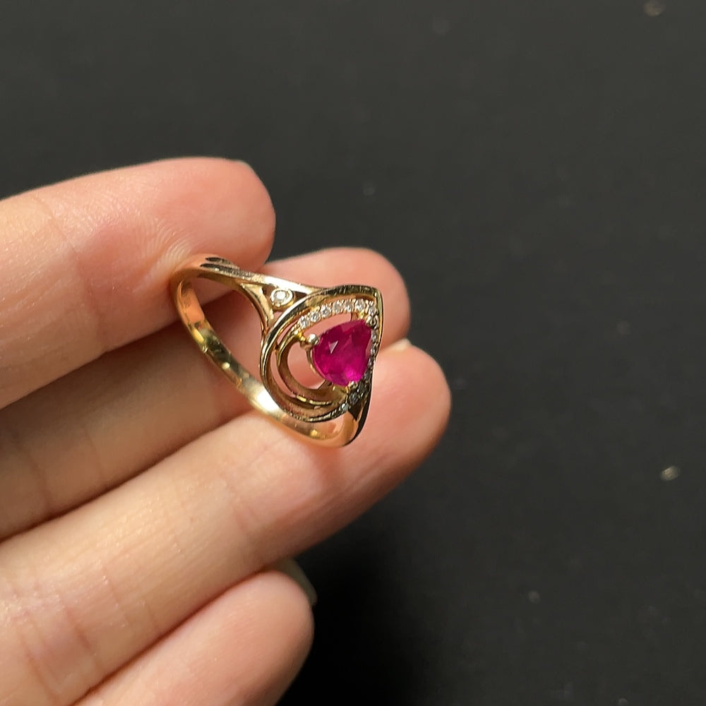 Ruby ring with diamond accents, 18K gold