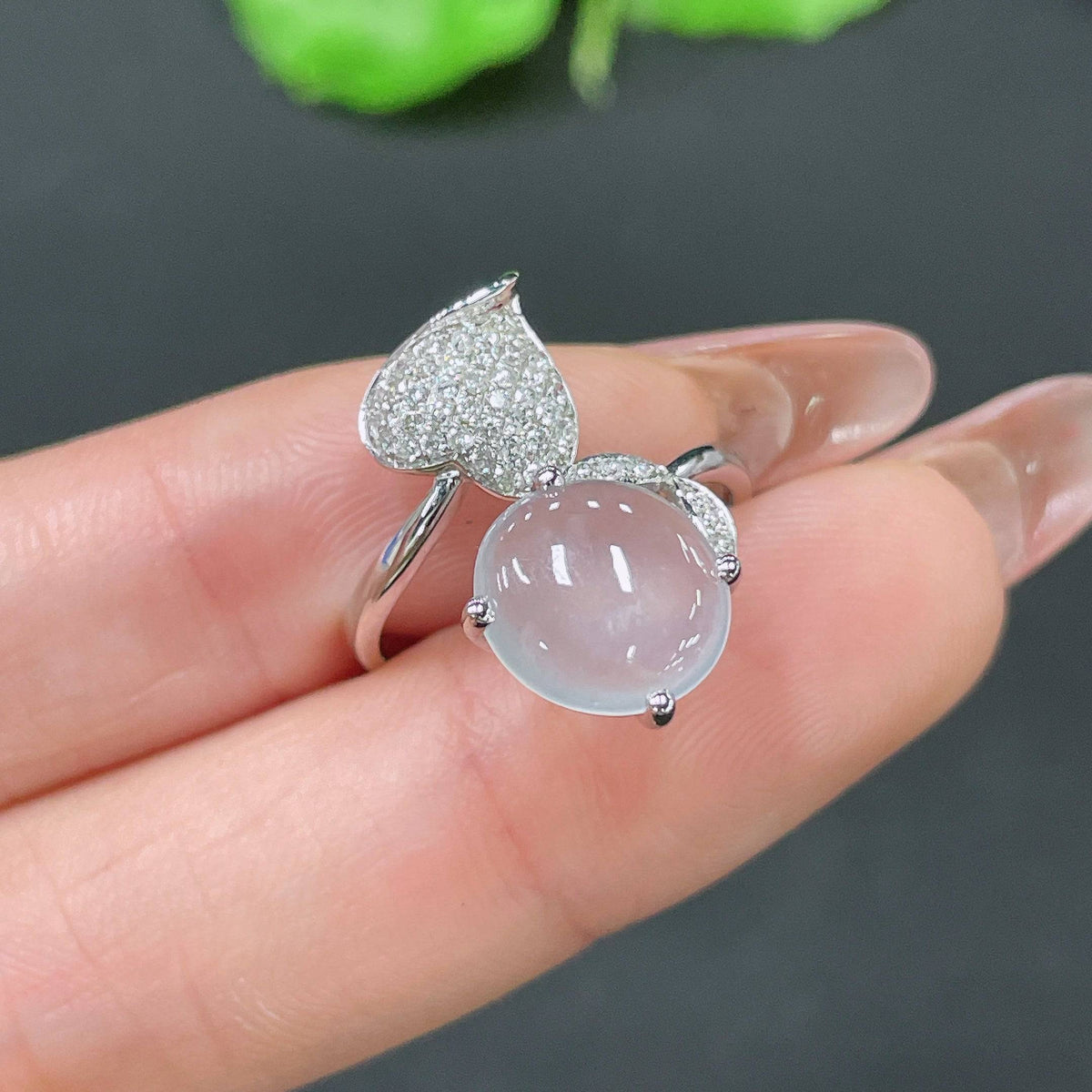 Jadeite cabochon ring with 18k gold band and diamond accents, size 12, featuring a smooth green jade gemstone and elegant design