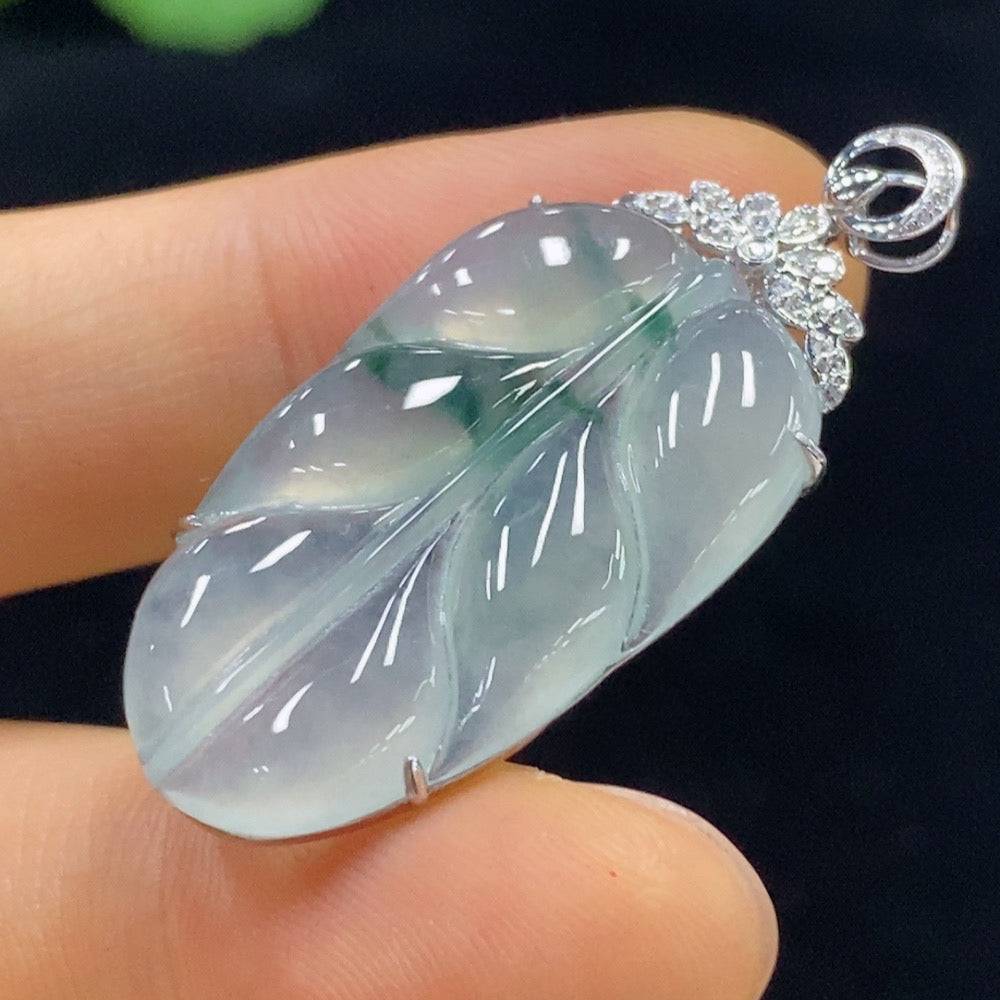 Jadeite leaf pendant with 18k gold and diamond accents, crafted by HUILIU HQ, featuring intricate leaf design and polished finish.