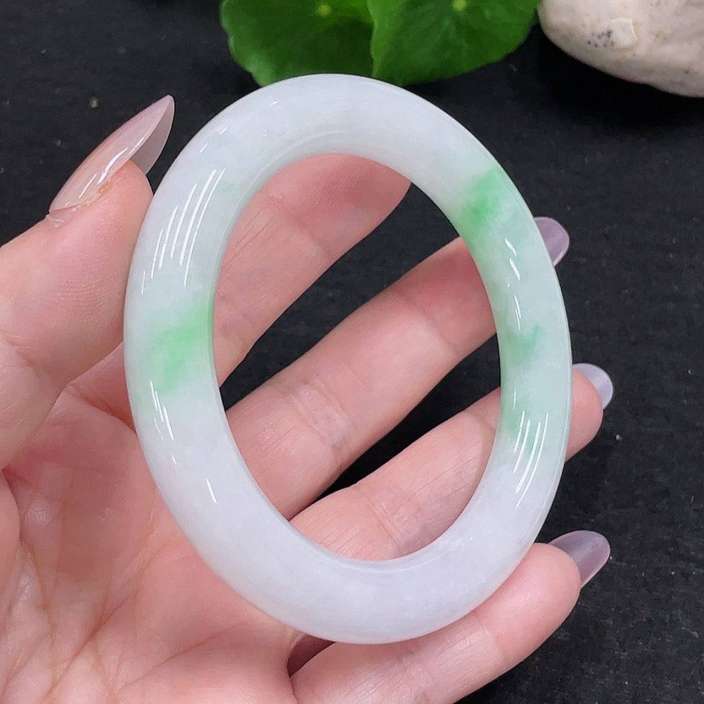HUILIU HQ jadeite round bangle with size 54 and weight approximately 57.4g, showcasing smooth, polished jade surface.