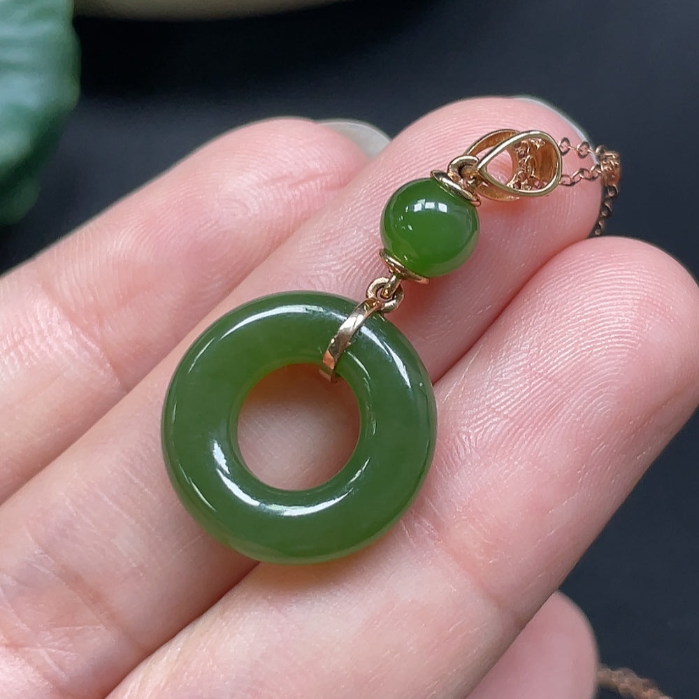 Hetian jade peace knot pendant with 18K gold and diamond accents, HKHQ, delicate jewelry featuring intricate design.