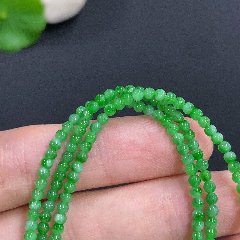 Jadeite bead necklace by HKHQ featuring smooth green jade beads, non-gold, lightweight 7.7g, elegant jewelry accessory.