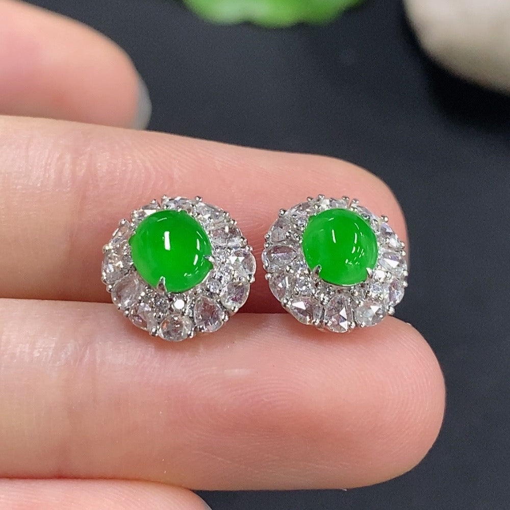 Jadeite earrings by HKHQ with 18k gold and diamond accents, showcasing elegant green jade stones and intricate design.