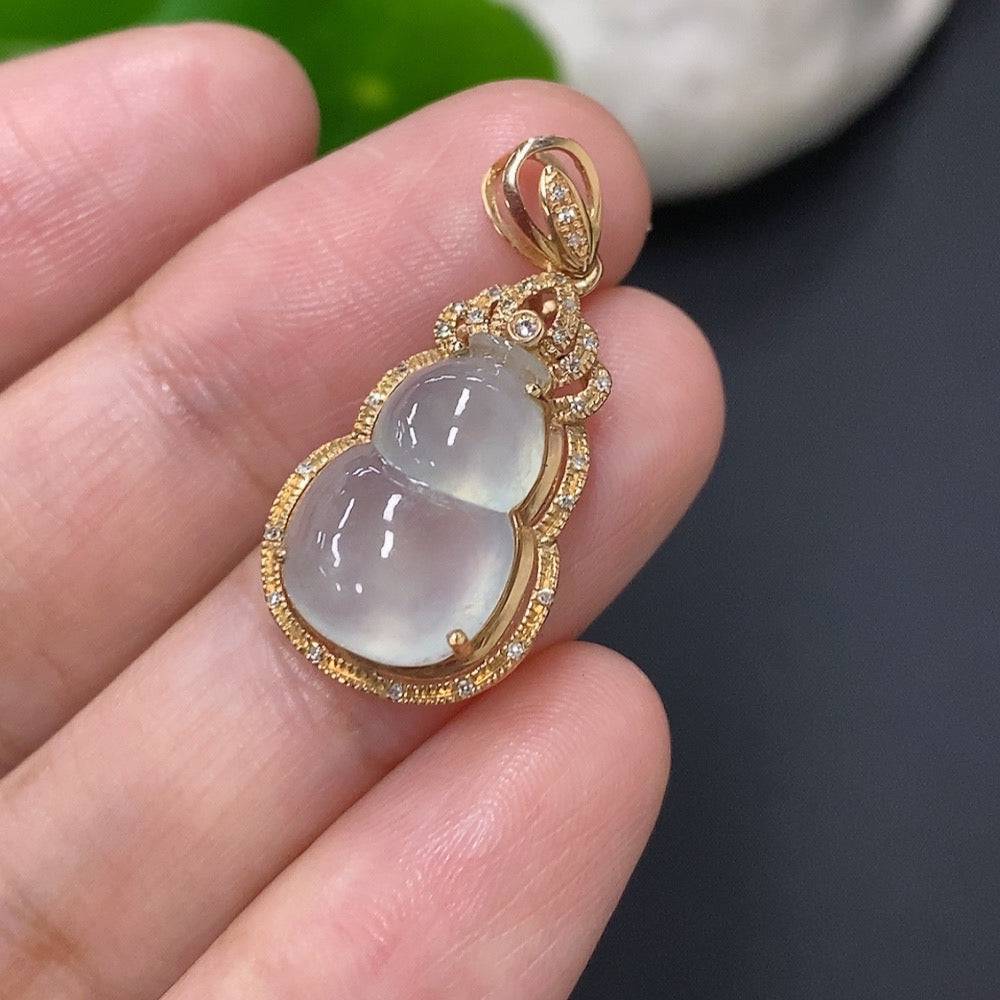 Jadeite inlaid gourd pendant with 18k gold and diamond accents, showcasing intricate craftsmanship and elegant design.