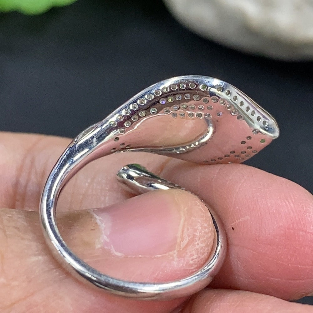 Jadeite freeform inlaid ring with 18K gold band and diamond accent from HKHQ, showcasing a unique design and polished finish.