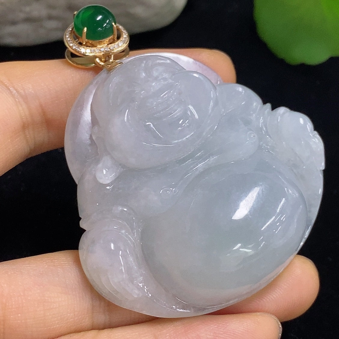 Jadeite Buddha pendant necklace by HKHQ featuring 18K gold, diamond accents, and a green cabochon jadeite.