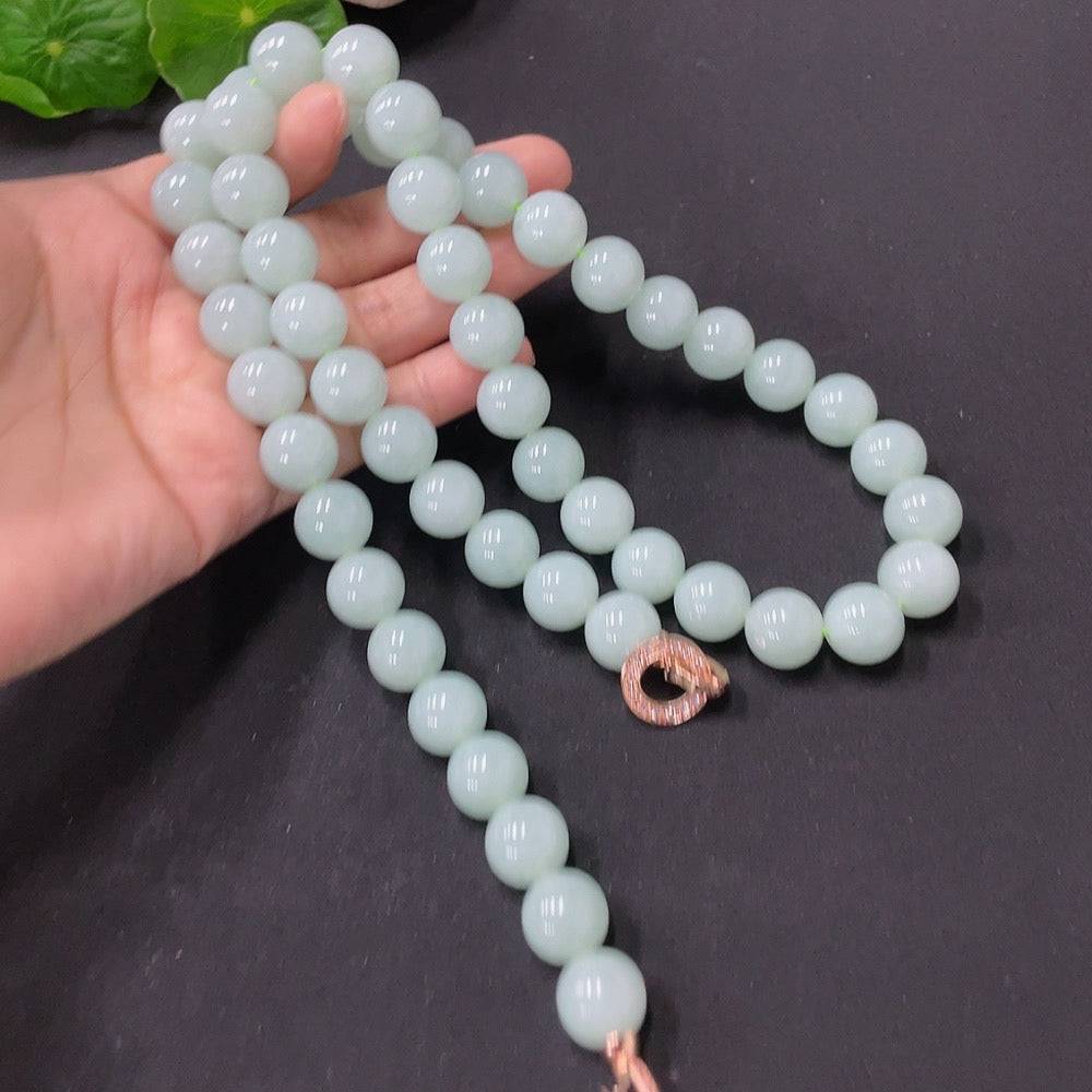Huiliu Jadeite bead necklace with 11.5mm round, non-porous jade beads, showcasing smooth, polished green stones.