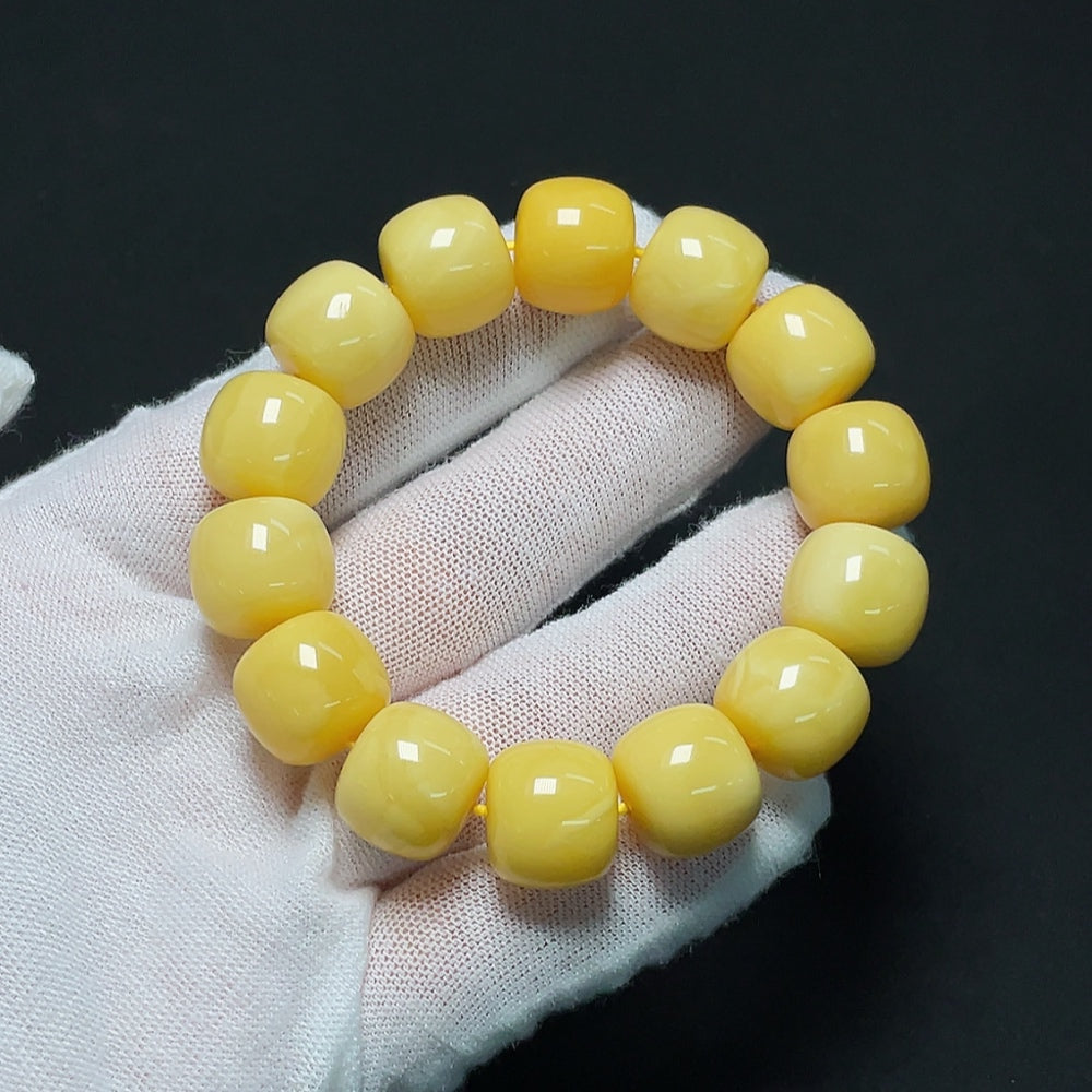 Amber beeswax bracelet with 13.8mm beads, weighing approximately 22.64g, featuring warm amber tones and natural craftsmanship.