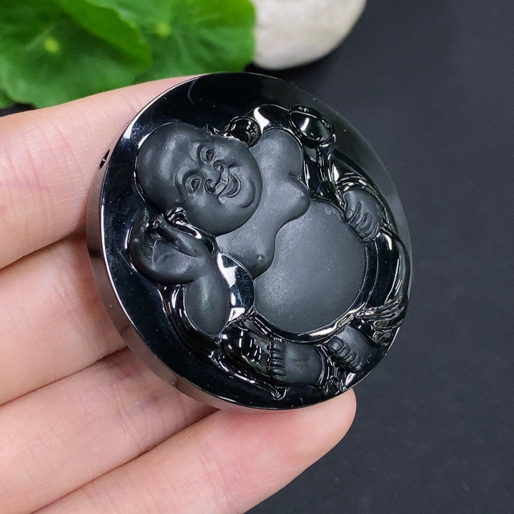 Jadeite Buddha pendant from HKHQ showcasing a detailed carved Buddha figure on smooth, green jade stone, weighing approximately 44.6g.