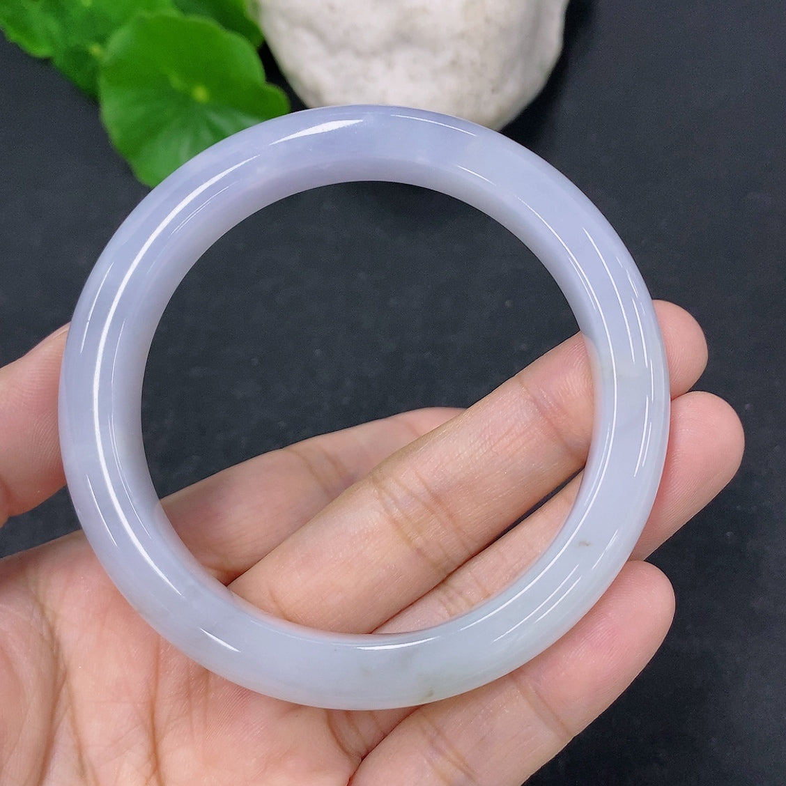 HKHQ jadeite round bangle with 53.8mm diameter and 49.63g weight, showcasing smooth, polished jadeite surface and elegant craftsmanship.