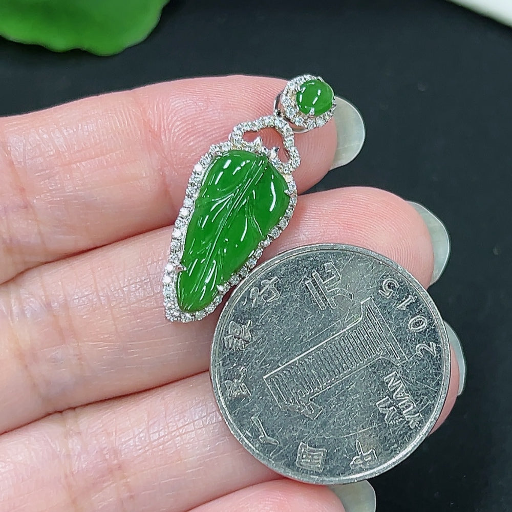Jadeite leaf pendant with diamond accents in 18K gold, crafted by HKHQ, weighing approx. 3g, featuring a detailed leaf design.