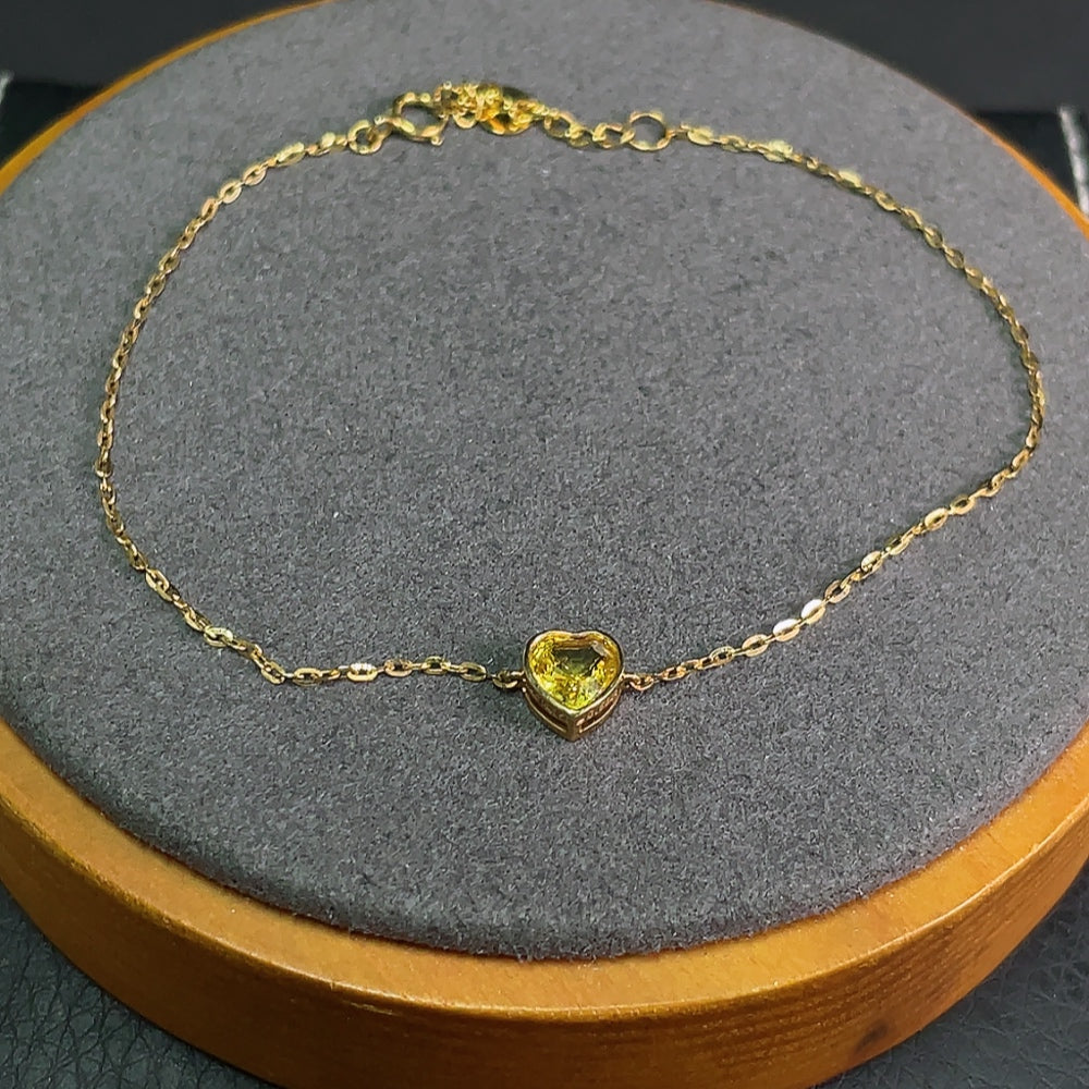 HKHQ sapphire inlaid 18k gold bracelet with gemstone details, lightweight jewelry featuring blue sapphire accents.