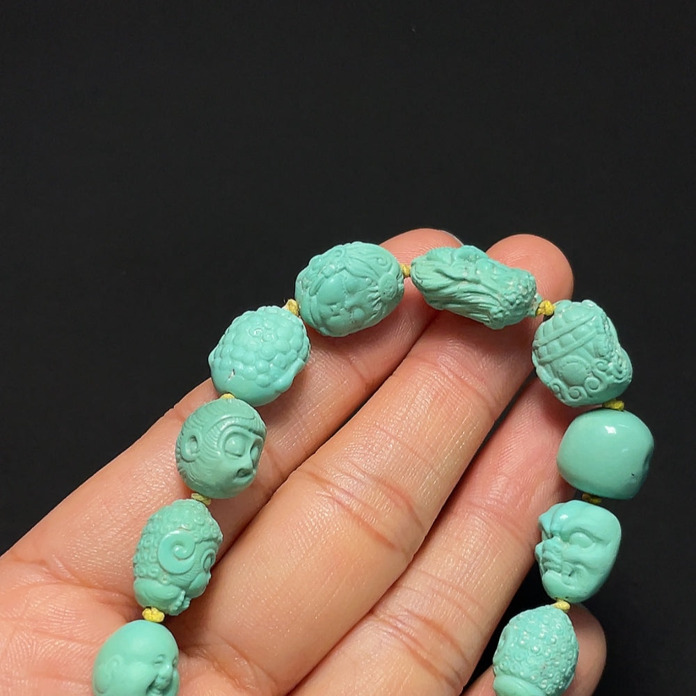HKHQ turquoise bracelet featuring smooth, polished beads on an elastic band, showcasing vibrant blue-green gemstone jewelry.