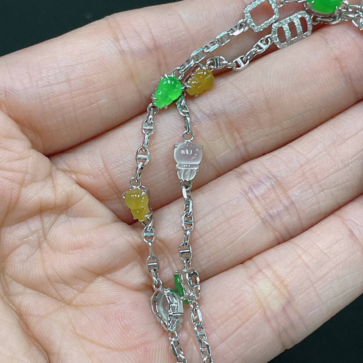 HUILIU HQ jadeite necklace with 18k gold chain and diamond accents, weighing approximately 10.4 grams.