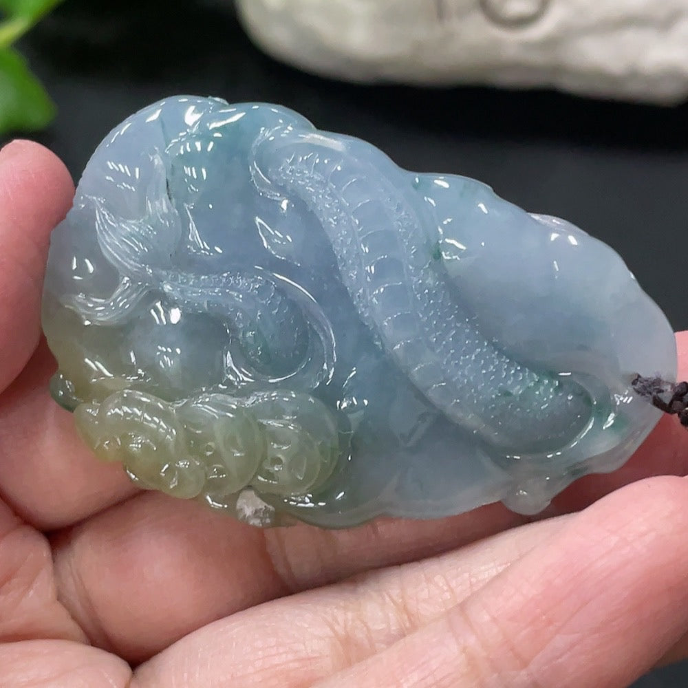 Jadeite dragon soaring pendant by HUILIU HQ, featuring intricate dragon design, weighs approx. 46.3g with rope, from Master Collection.