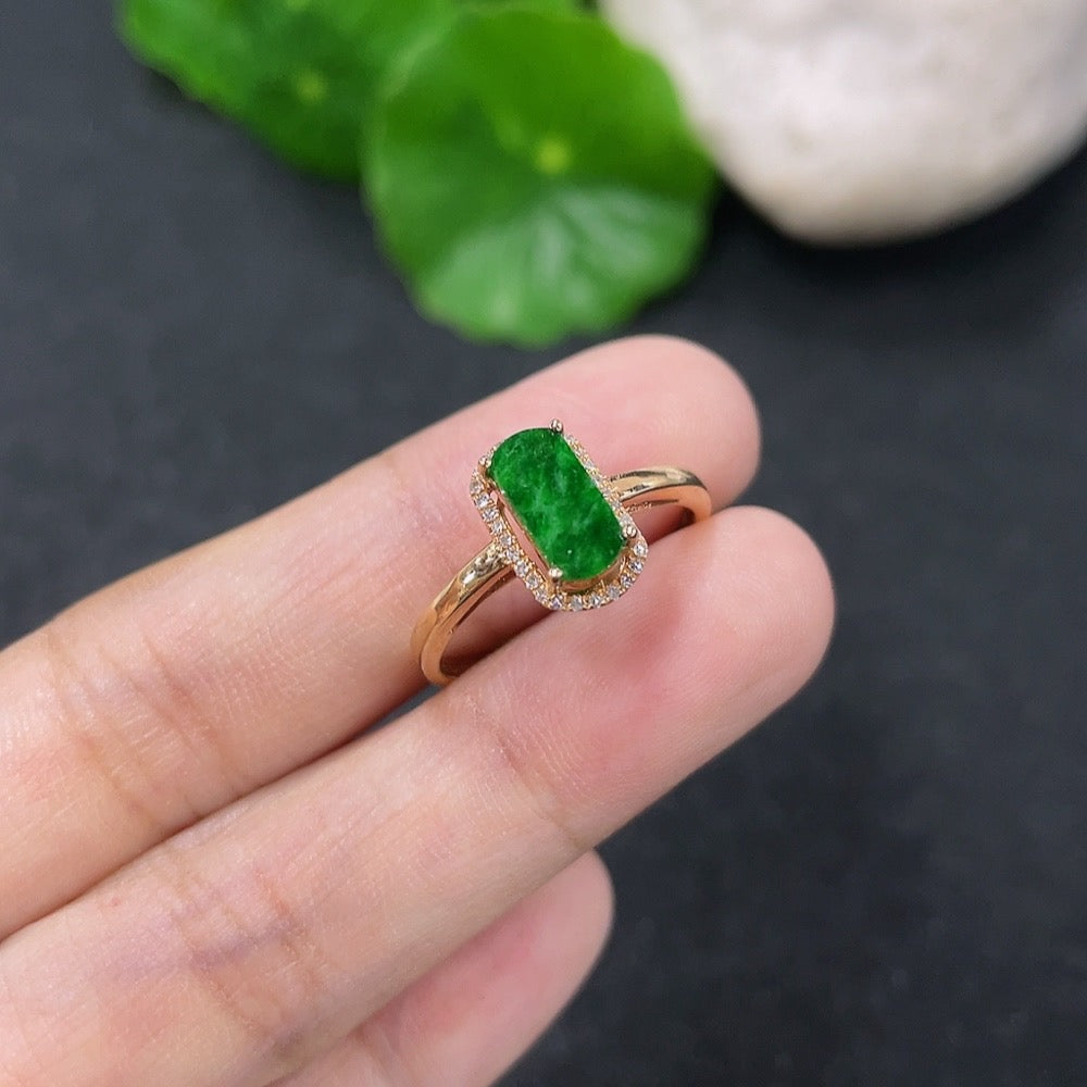 Jadeite and diamond ring in 18k gold with size 14, featuring a polished band and sparkling gemstones.