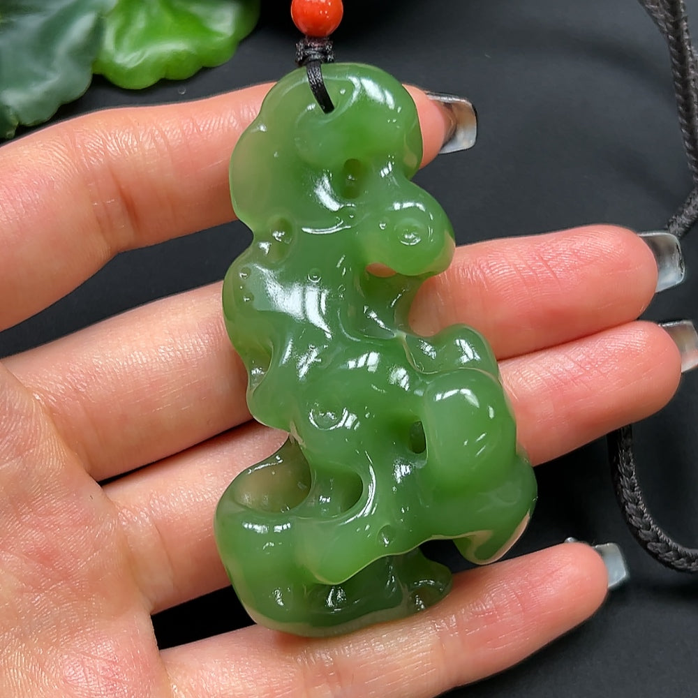 HKHQ Hetian jade and coral stone pendant necklace with rope, weighs approximately 48.17g, featuring a detailed jewelry design.