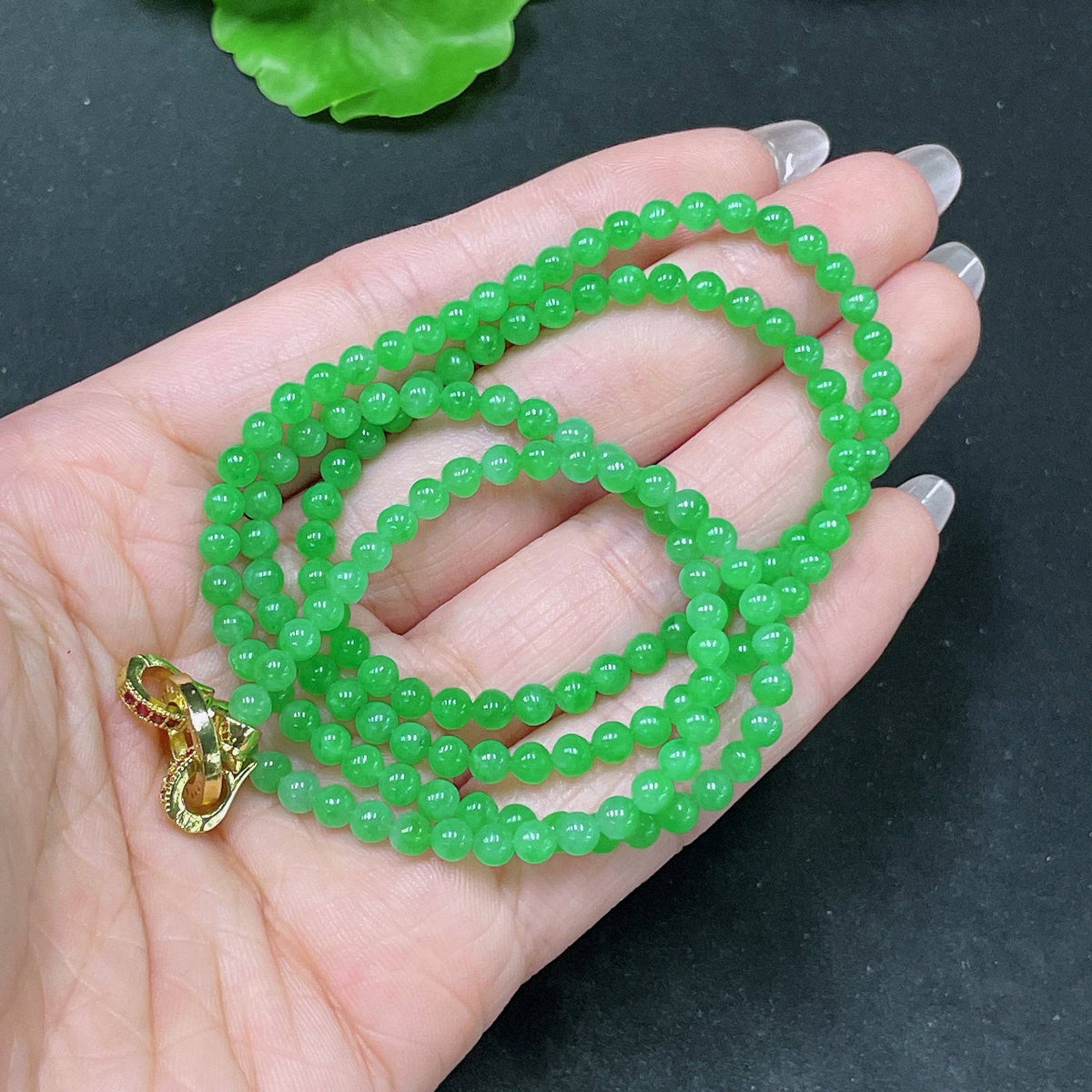 HUILIU HQ jadeite bead necklace with 3.8mm jade beads, non-gold, total weight 16.8g, close-up of the beaded jewelry.