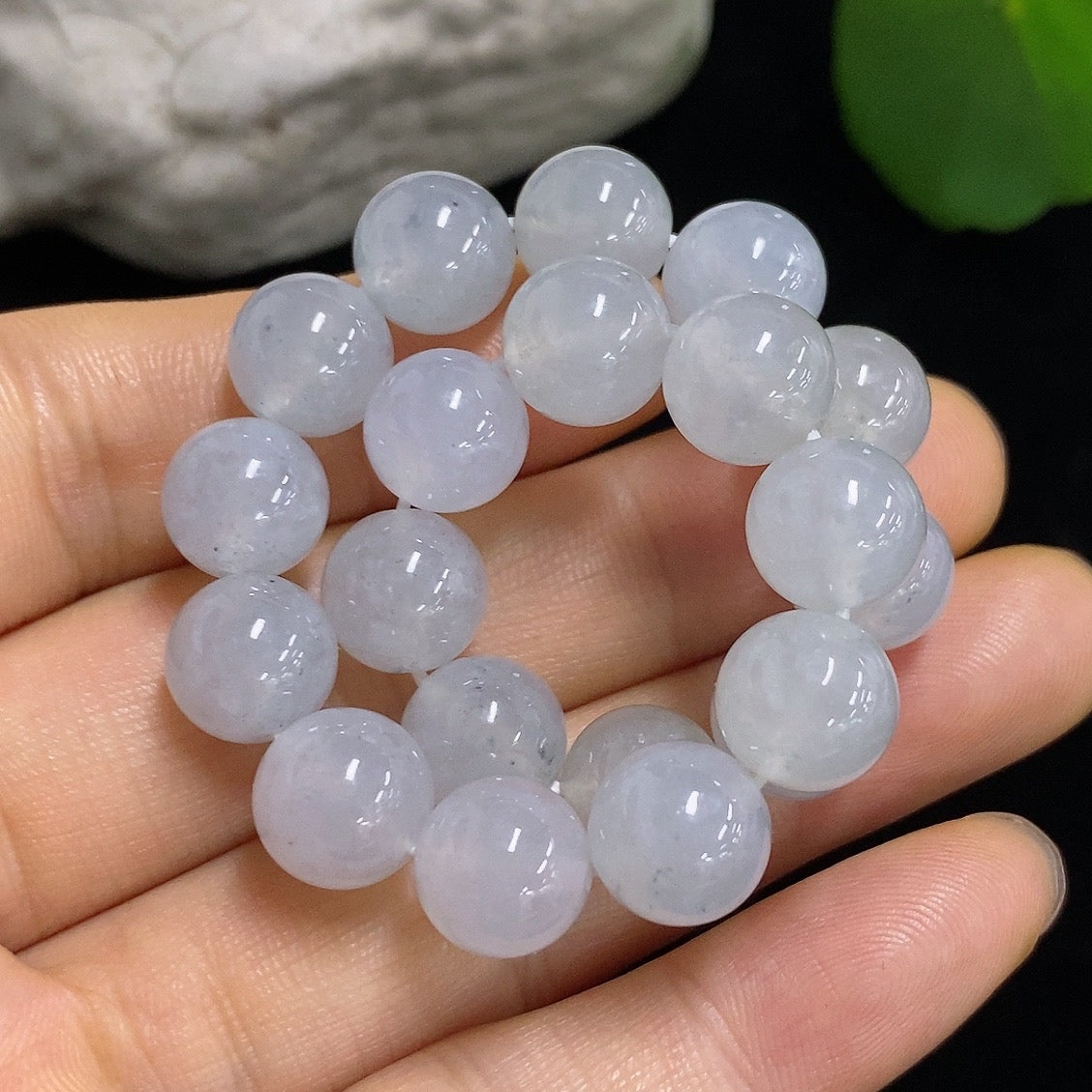 HKHQ jadeite bracelet with 9.6mm beads, approximately 31.93g, showcasing smooth, polished jadeite stones on a flexible bracelet.
