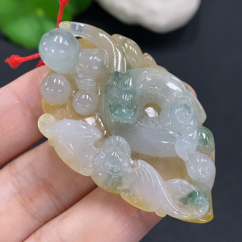 Jadeite pendant with cord, total weight approximately 25.2g (color origin undetermined)
