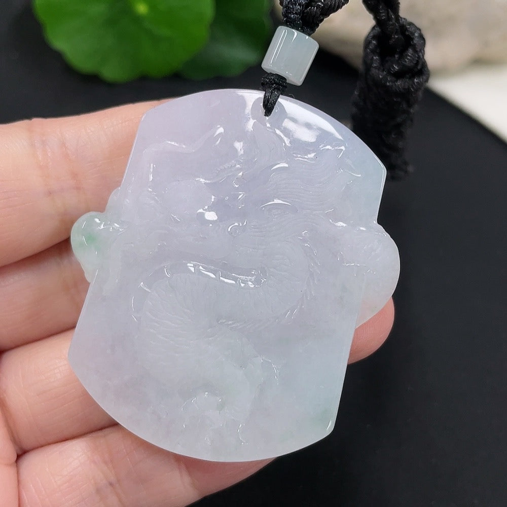 Jadeite dragon pendant from HUILIU HQ, carved jade jewelry with intricate dragon design, weighs approximately 34.52g including rope.