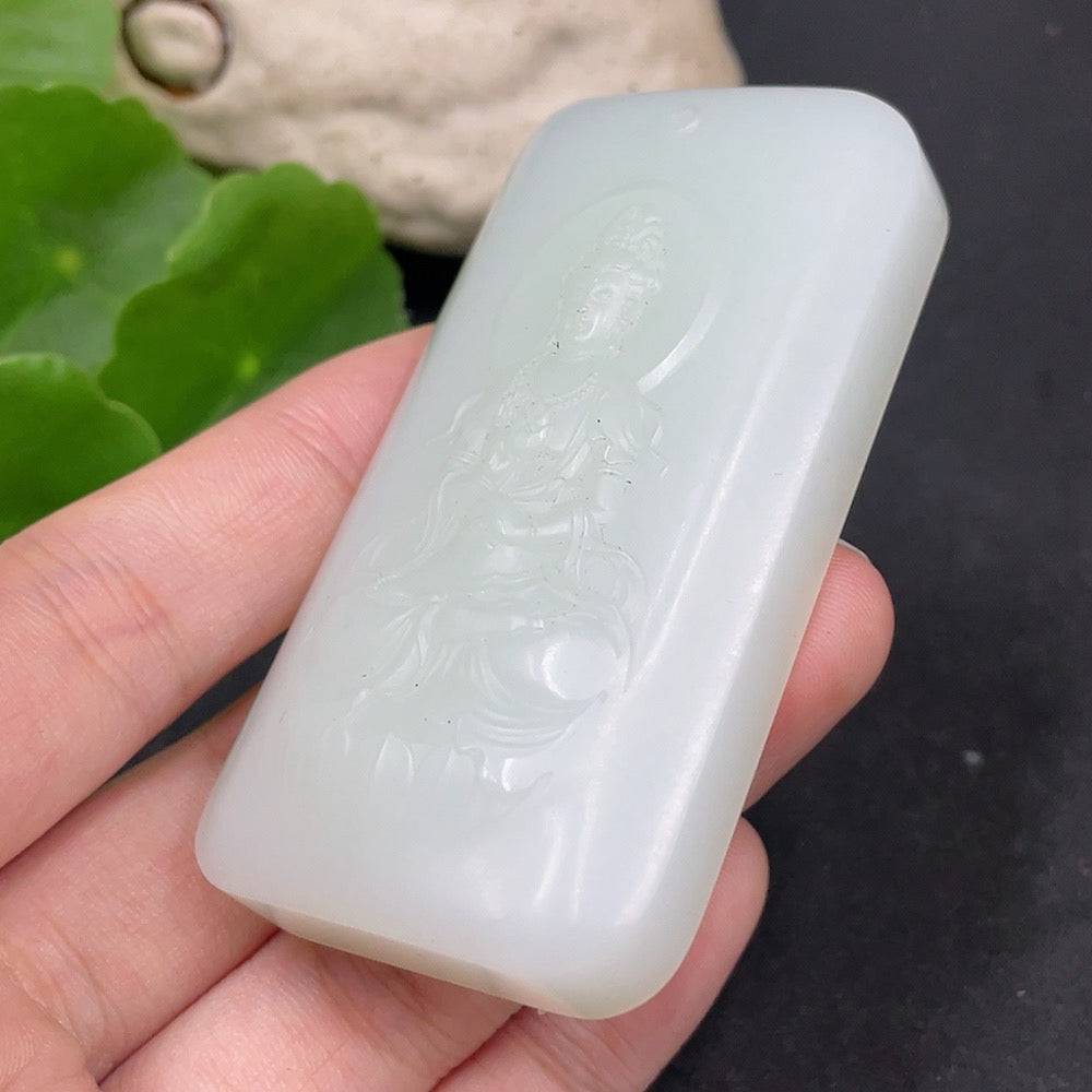 Huiliu certified Hetian jade Guanyin pendant featuring intricate carved details, showcasing elegant craftsmanship.