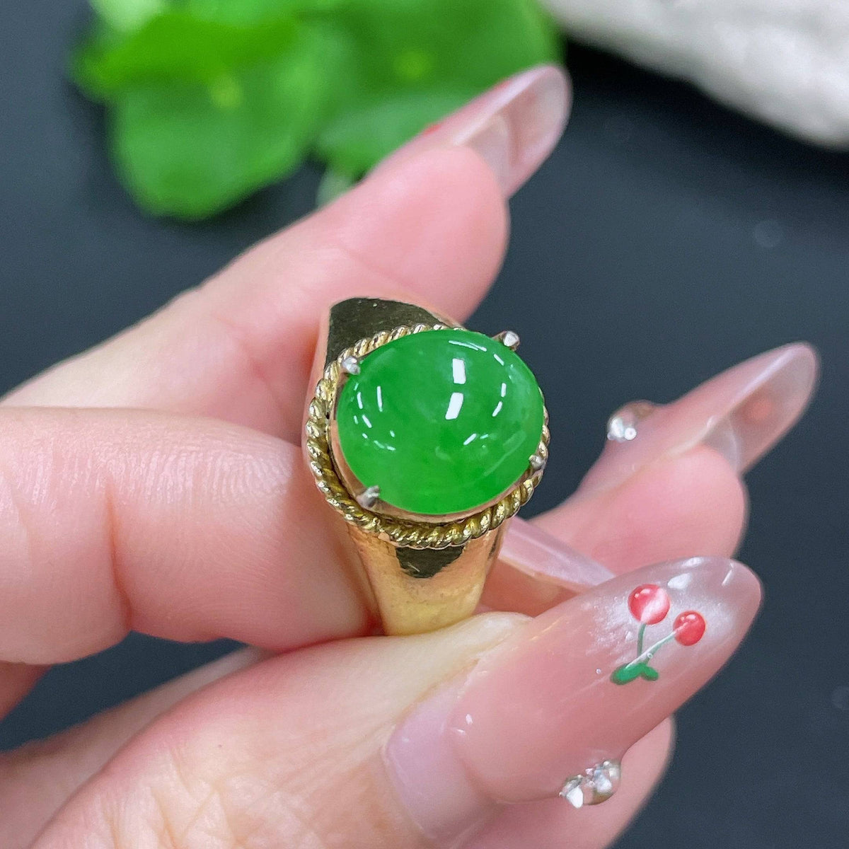 Jadeite cabochon from HUILIU HQ, non-gold, weighing approximately 12.26g, featuring smooth, polished jade surface.