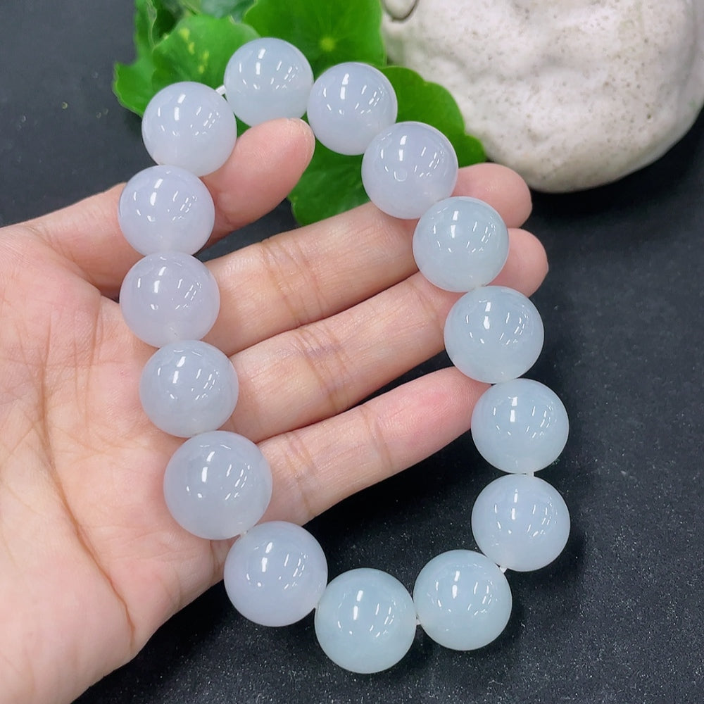 HKHQ Jadeite bracelet with 15.4mm beads, showcasing smooth, polished jadeite stones on a delicate bracelet.